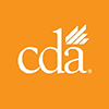 The image shows a logo with the text  CDA  prominently displayed in a stylized font, set against an orange background with a partial graphic resembling a leaf or flower on the left side.